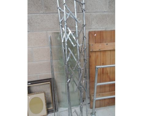 A selection of art deco style chrome and glass shelves