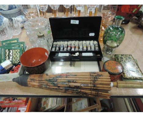 A selection of art supplies and cigarette holders