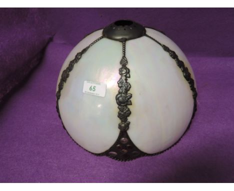 A tiffany style light shade with mother of pearl style body