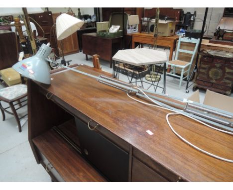 A vintage desk mounted angle poised lamp
