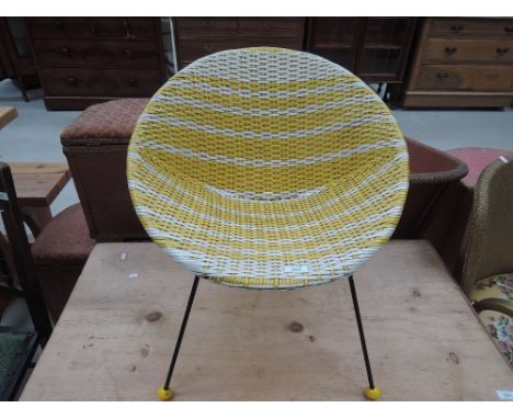 A vintage 'Atomic' style woven childs tub chair