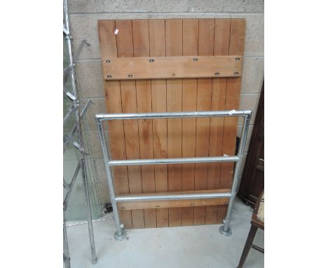 A trestle table top and vintage chrome towel rail