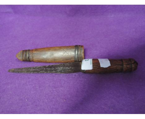 A small antique wooden handled knife and scabbard 