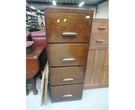 A vintage wooden filing cabinet