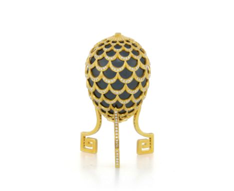 Adler, ornamental egg&nbsp;hematite covered by a pine cone pattern in 18K gold, on its 18K gold base, set with round brillant
