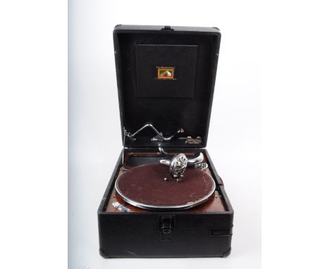 A vintage early to mid 20th century His Master's Voice HMV portable wind up gramophone record player. Turntable to the interi