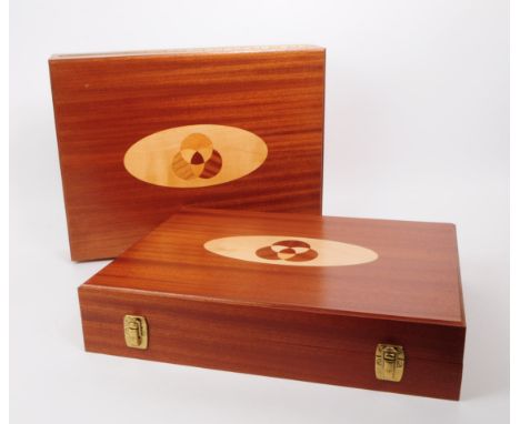 Two modern backgammon board game cases. House in a hinged wooden box. With pieces, black tie sack, two shakers and metal gilt