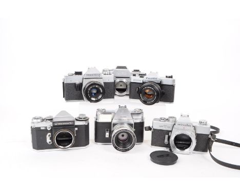 A collection of vintage mid 20th century 35mm SLR cameras. The collection featuring six 35mm SLR camera bodies, including a M