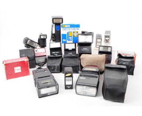 A collection of vintage camera flash units, examples including a Kako Hi-Beam II, a Minolta auto 200x, a Promatic Computer Fl