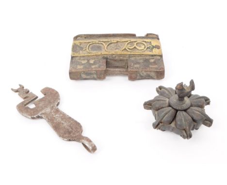 A 19th century Indian bronze seven segment kum kum spice pot raised on seven feet with a bird screw in sculpture atop, alongs