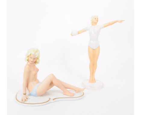 Two vintage 20th century German porcelain blonde lady figurines comprised of a Wagner &amp; Apel half nude woman sitting and 