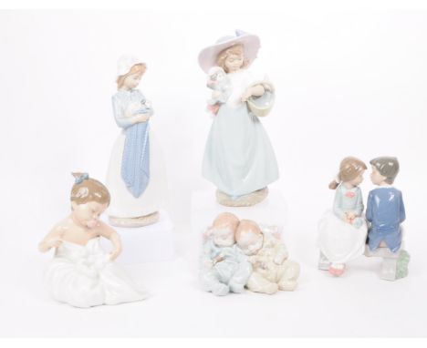 Lladro - Nao - Five late 20th century porcelain figures. Comprised of a two babies no. 5772, a toddler in a blanket no. 1337,