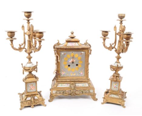 Early 20th century French garniture clock set. With finial to top with silver face and eight movement. With gilt gesso foliat