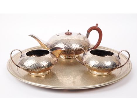 Early 20th century arts and crafts EPNS silver plated tea service in the manner of Archie Knox. Comprised of a teapot, sugar 
