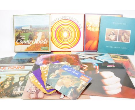 A large collection of late 20th century rock LP vinyl records, examples including names such as Bob Dylan, John Lennon, Cat S