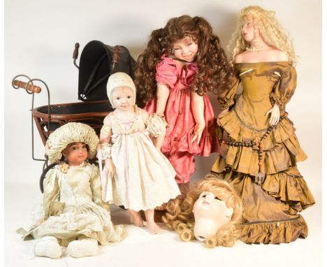 Collection of 20th century porcelain dolls and pram. Dolls from makers such as Michele H Severine1993, S. Scott, YPB 1994, an