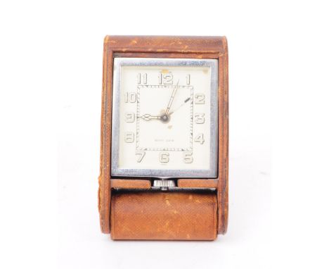 Jaeger Le Coultre - An early 20th century Swiss art deco travel clock, housed within a French made leather case able to be ex