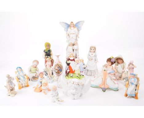 A collection of late 19th / early 20th century bisque porcelain figures, examples including Nurse Clara by Enesco, Victoria A