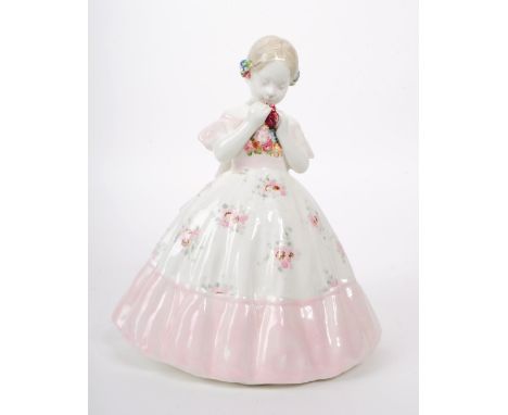 Johann Petrides for Goldscheider - A 1920 art deco porcelain figurine of a girl holding a rose, featuring a hand painted pink