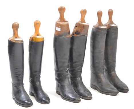 Three pairs of black leather ladies hunting horse riding boots with wooden tree inserts. Unbranded wooden trees or boots.