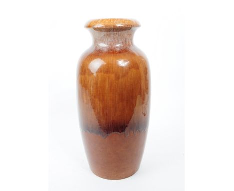 Mid 20th century West German ceramic studio pottery vase. In a brown colourway with a dripping glaze design. Stamped scheuric