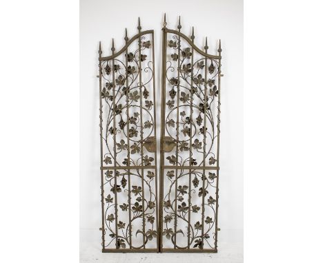 GATES, a pair, circa 1972, steel with vine decoration, stamped I. D. Lamb, R. A. Eastman and dated, approx 100cm W x 212cm H.