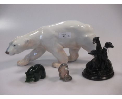 A Royal Copenhagen polar bear, a resin greyhound group, a jade polar bear and a china otter (4)  