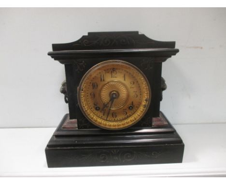 A slate mantel clock by Ansonia dated 1882, 28cm high  