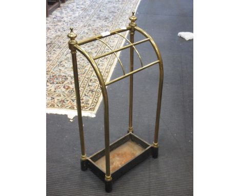 A polished brass and iron stick stand  