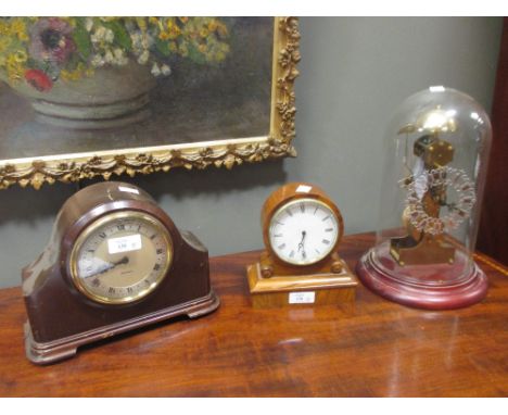 A gilt wood case sunburst wall timepiece by Camerer Cuss, a 20th century skeleton clock, a walnut mantel timepiece and anothe
