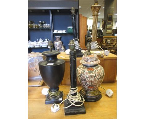 A collection of eleven lamp bases to include a Japanese painted metal example, 17th century style gilt wood singular lamps, g