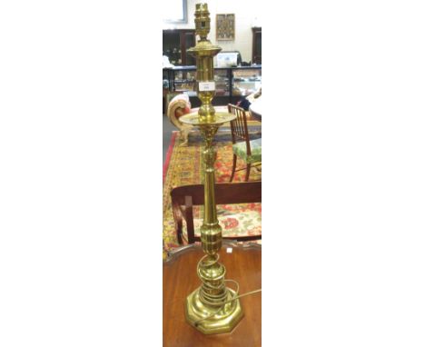 A 19th century brass alter candlestick, converted as a table lamp, 75cm high  