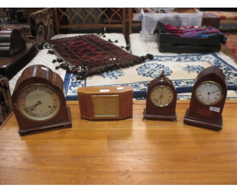 Three mid 20th century mantel timepieces by Elliott, London and a balance wheel mantel timepiece in inlaid arched case (4)  