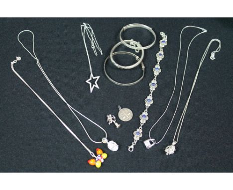 SILVER AND GOLD JEWELLERY - a collection of three bangles, a bracelet, two pendants and five necklaces, to include a 9k diamo