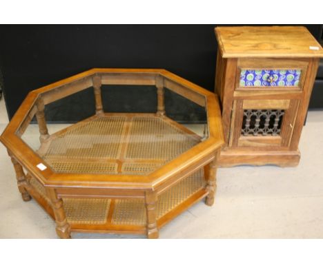 CUPBOARD AND COFFEE TABLE - a Moroccan style squat cupboard and octagon rattan coffee table. Cupboard drawer features ceramic