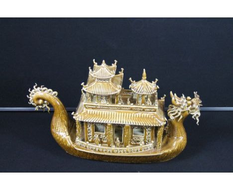 CERAMIC DRAGON BOAT - A brown glaze dragon boat C20th, measures in length 58cm (23").  Impressed markings to base.
