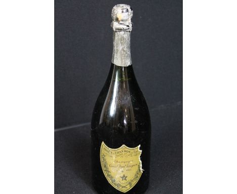 CHAMPAGNE - Moet & Chandon Cuvee Dom Perignon Vintage 1969, foil shows signs of wear and the label is ripped on the right sid