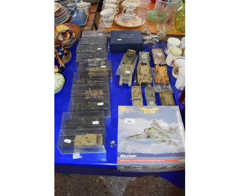 Quantity of military vehicles mainly tanks, some in original boxes together with a model of a bi-plane