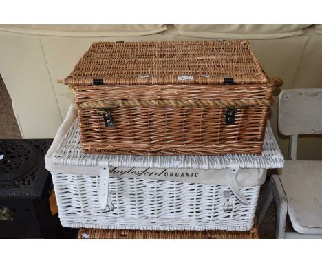 A Daylesford organic hamper basket together with one other