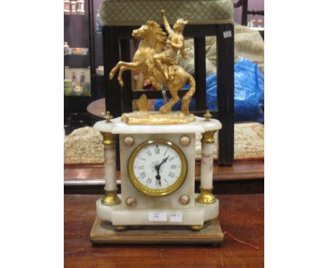 A gilt metal and alabaster mantle clock surmounted with a figure on a rearing horse  