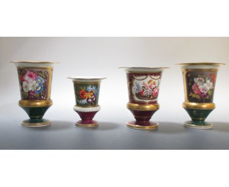 A pair and two other similar urn shaped vases, possibly Alcock's, each with the flat wavy edged rims gilt above flower painti