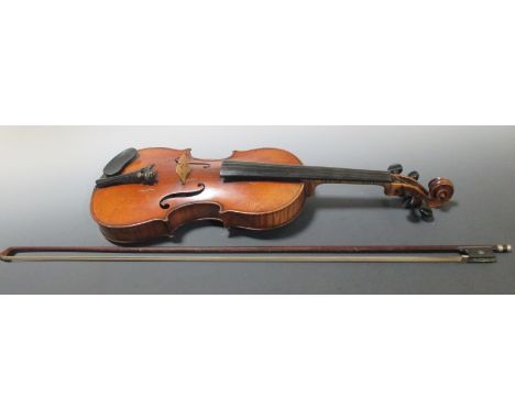 An early 20th century violin and bow, label for Stradivarius  