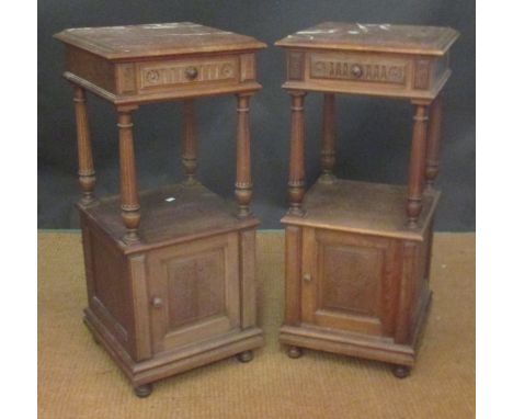 A pair of French walnut and marble top night tables, each fitted a single drawer, open shelf and cupboard, 92cm high x 41cm w