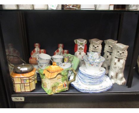 A floral decorated tea service, Staffordshire figures, country cottage tea pots and other items  