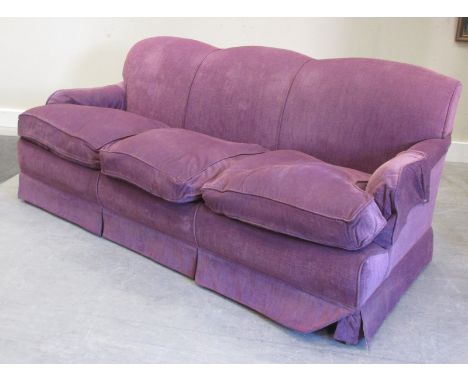 A three seater David Seyfried sofa, upholstered in Manuel Canovas prune material  