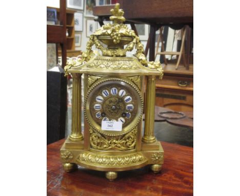 A 19th century French gilt metal mantle clock with cant wheel and bell striking movement  