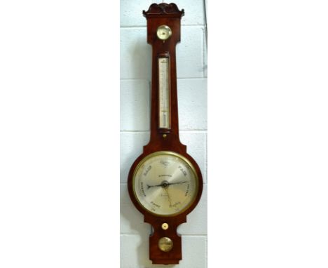 Dollond London, a mahogany wheel barometer, 19th century, with four silvered dials below a serpentine cresting, the thermomet