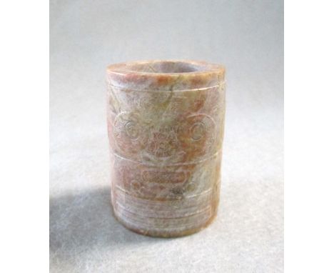 A jade opaque buff cong, possibly Liangzhu culture, the cylindrical body carved with taotie and geometrical patterns, 4.8cm h