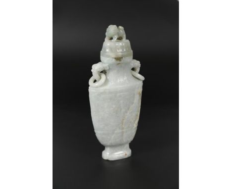 A nephrite jade ring-handled vase with cover and stand, 20th century, carved with two big Taotie to the body, the cover with 