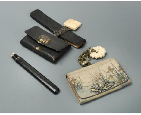 Two Sagemono and tools, Meiji period, one with a matching tooled leather pouch and pipe case Kitseruzutsu, the pouch fitted w